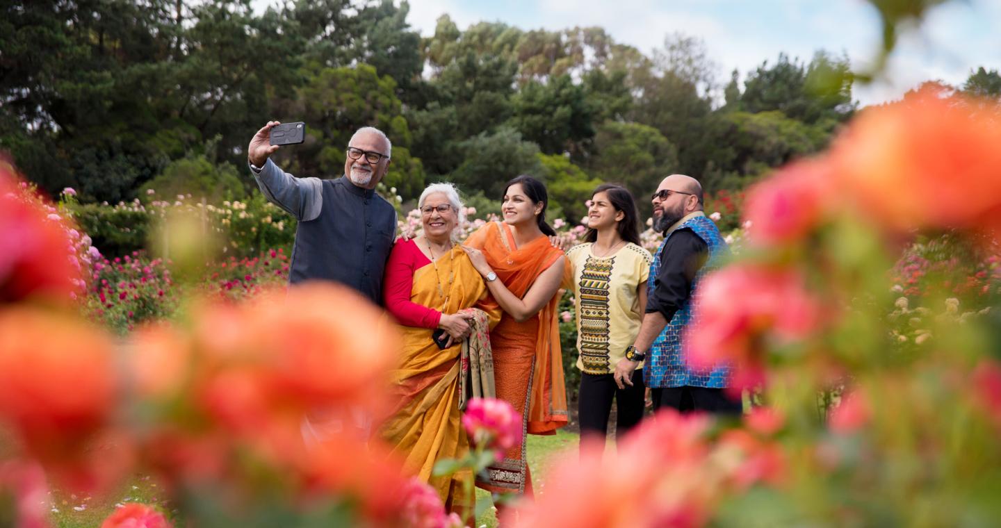 family in rose garden